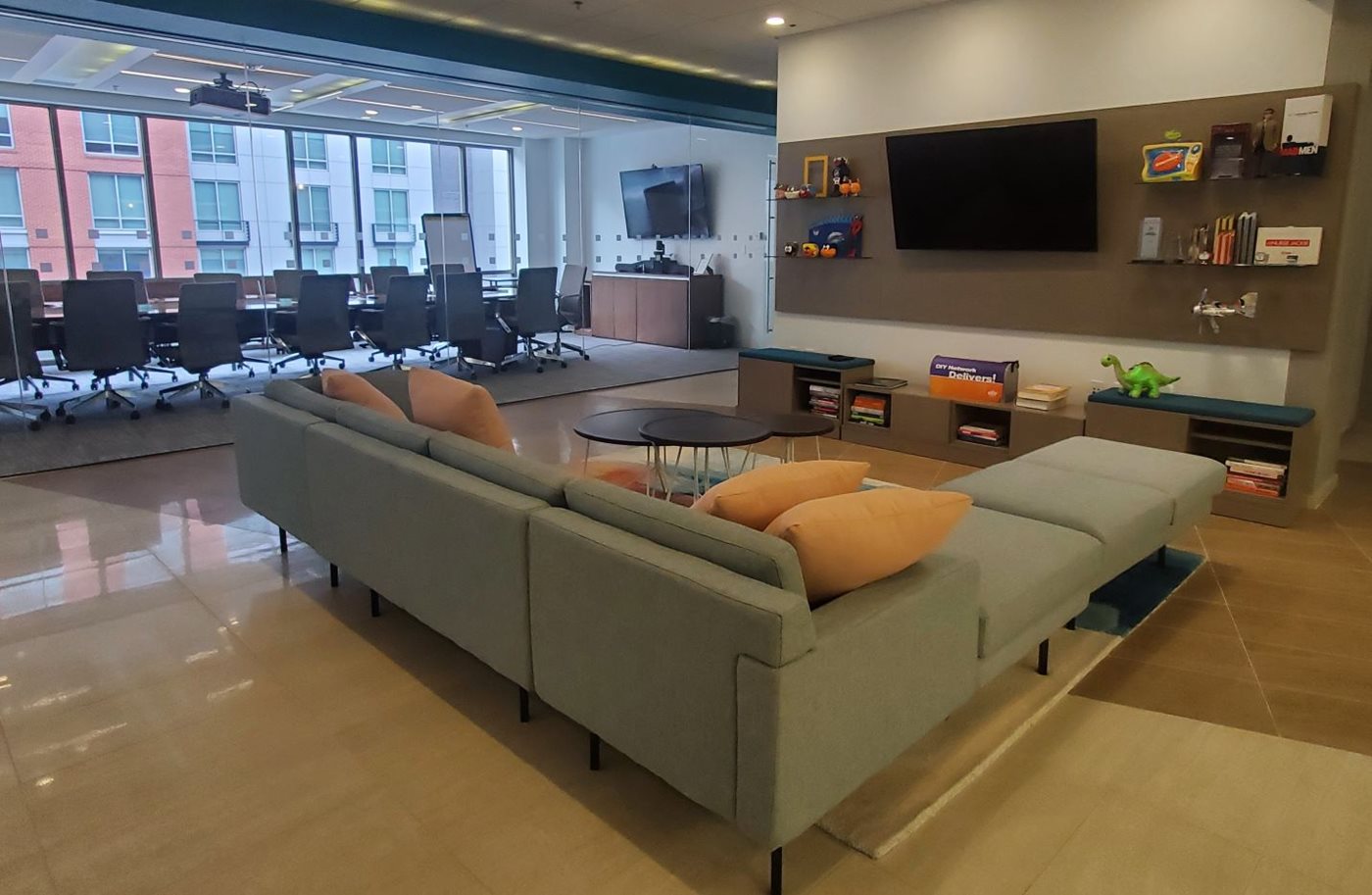 SmartMove office lobby featuring a couch and television near a conference room