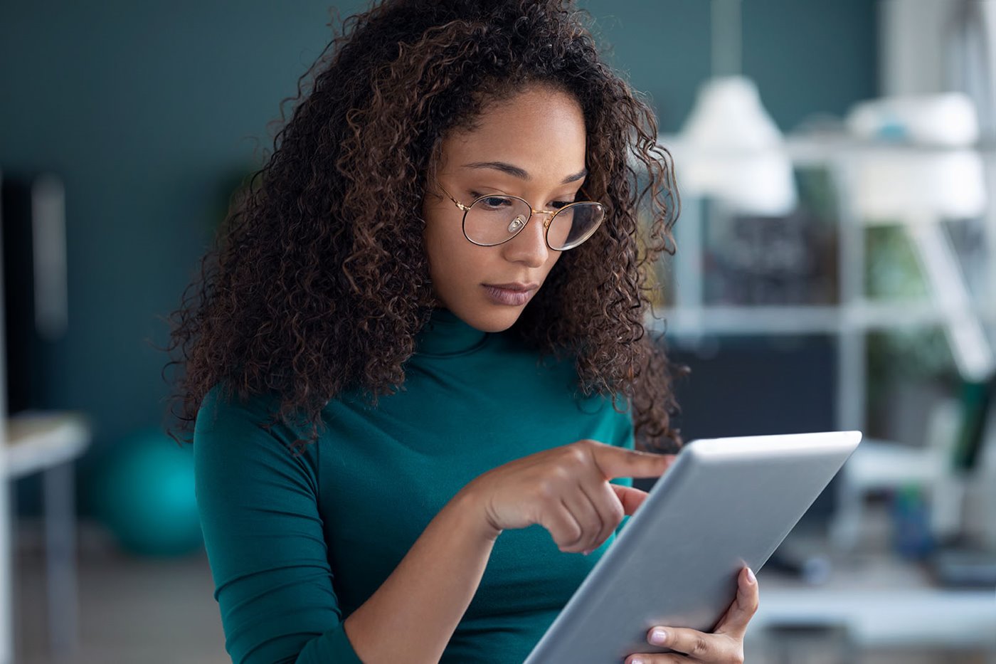 A woman explores MCTV Internet plans on her iPad